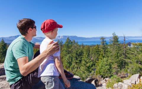 Father and son looking at the views overlooking Lake Tahoe