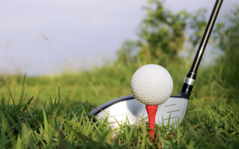 golf club hitting a golf ball