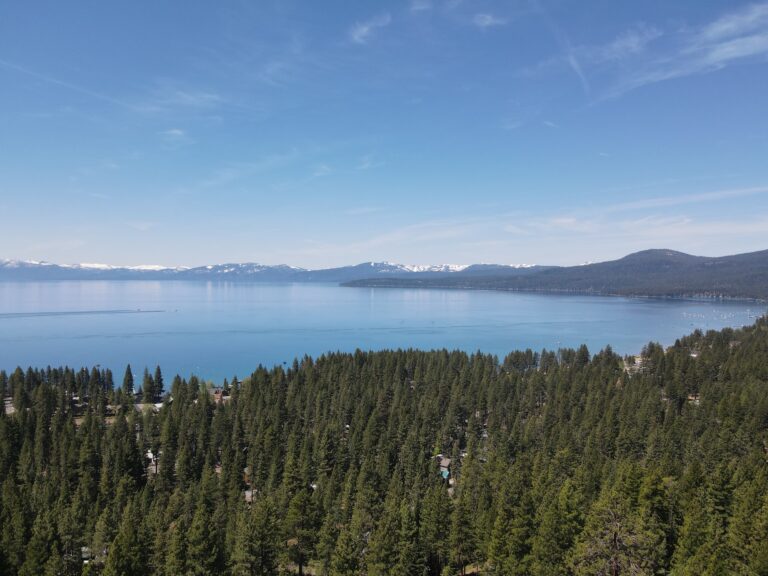 lake tahoe drone shot with snow capped mountains