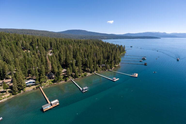 Aerial photo of lakefront homes and piers on Lake Tahoe